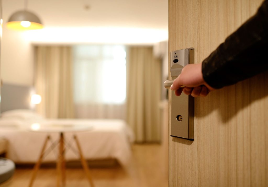 Avoid bed bugs while traveling by inspecting your hotel room before settling.